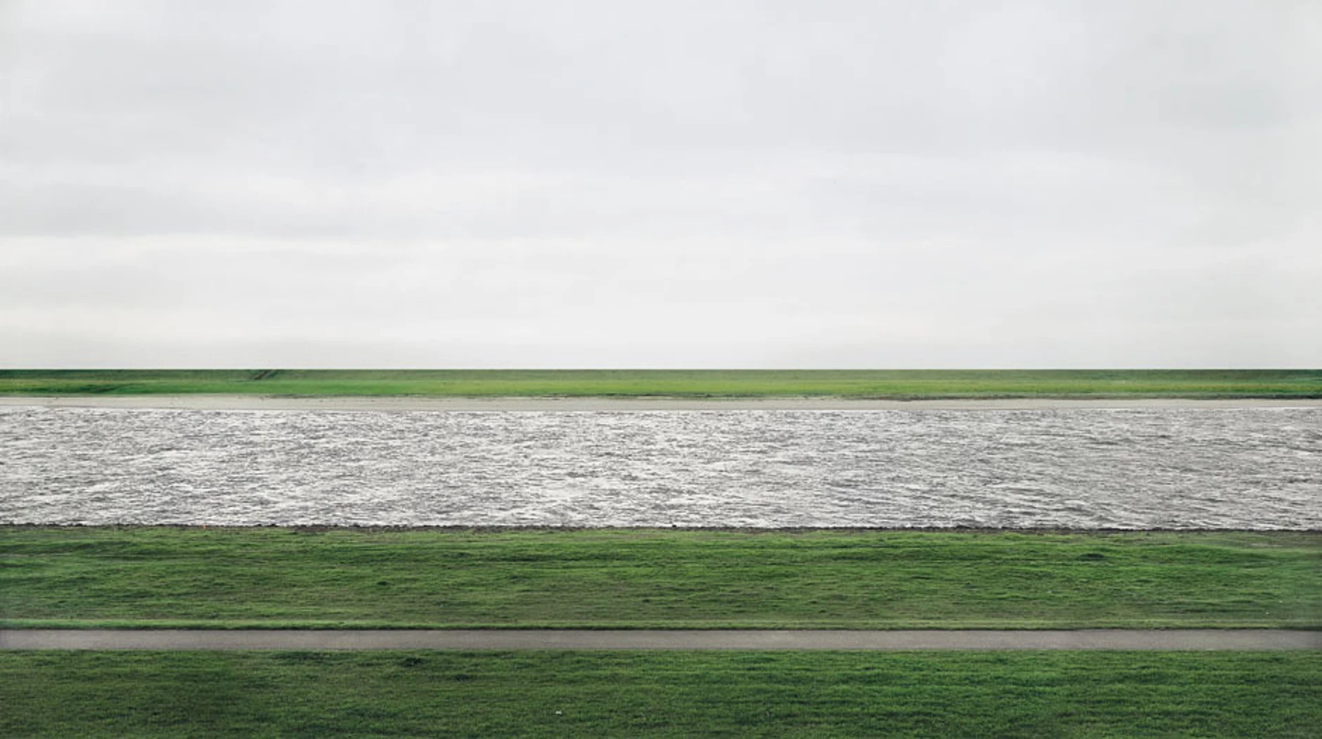The world record price at auction for a photograph Rhein II, taken in 1999 by Andreas Gursky. A print measuring 73 by 143 inches (190 cm × 360 cm) sold for US$4,338,500 at a Christie's auction in November, 2011.