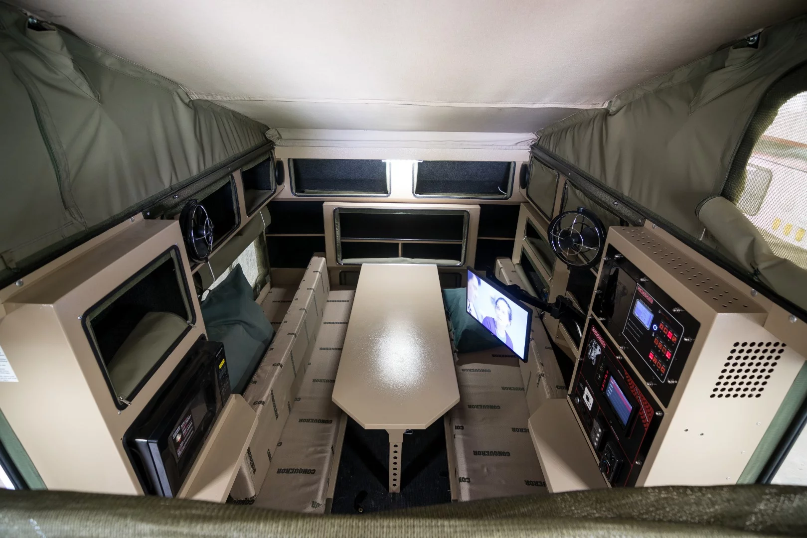 The Ultimate Service Titan benefits from its camping trailer construction with a desk/table that can be used for meetings/planning before converting into a bed for tending to victims