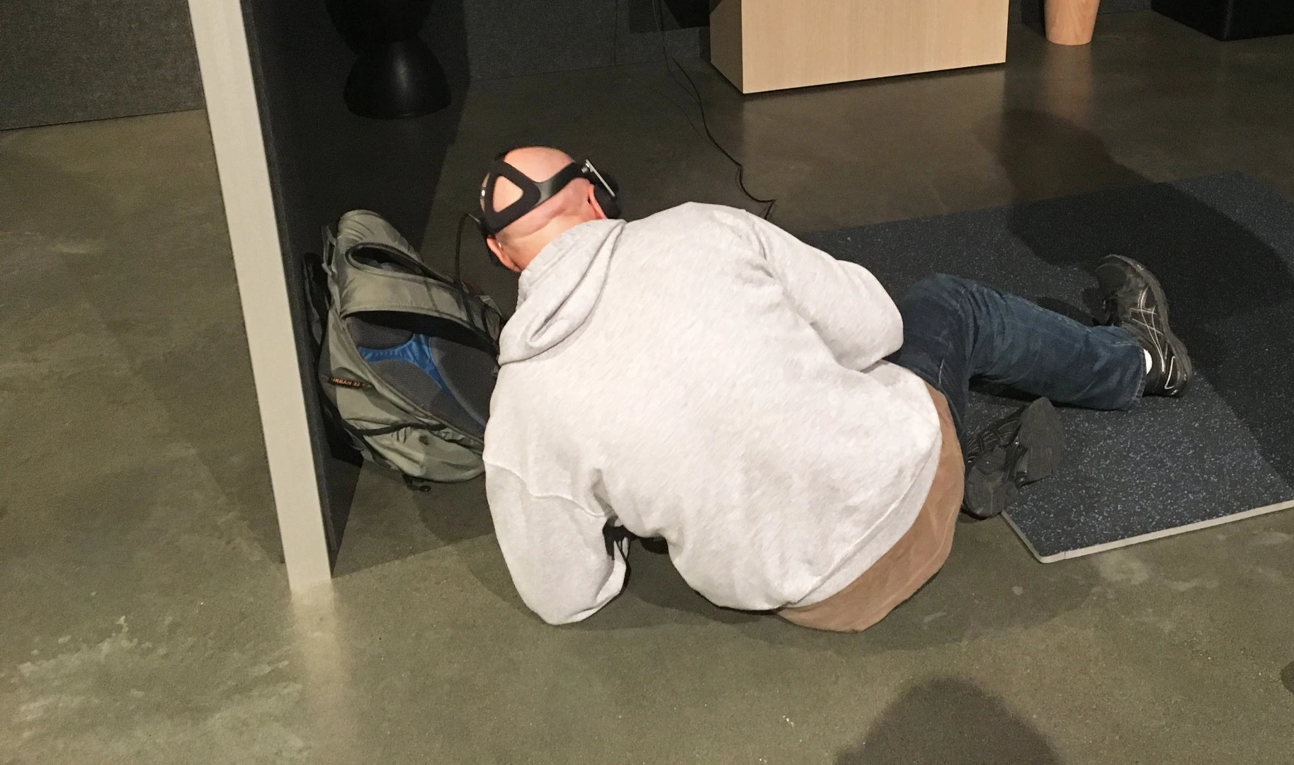 What's this fool doing? Why, he's taking cover in a wild west gunfight, of course
