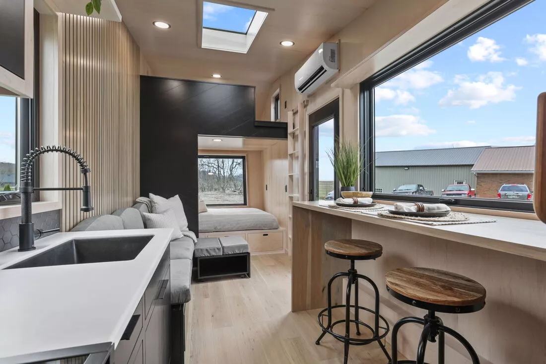 The Sangja's kitchen includes a breakfast bar seating area for two people