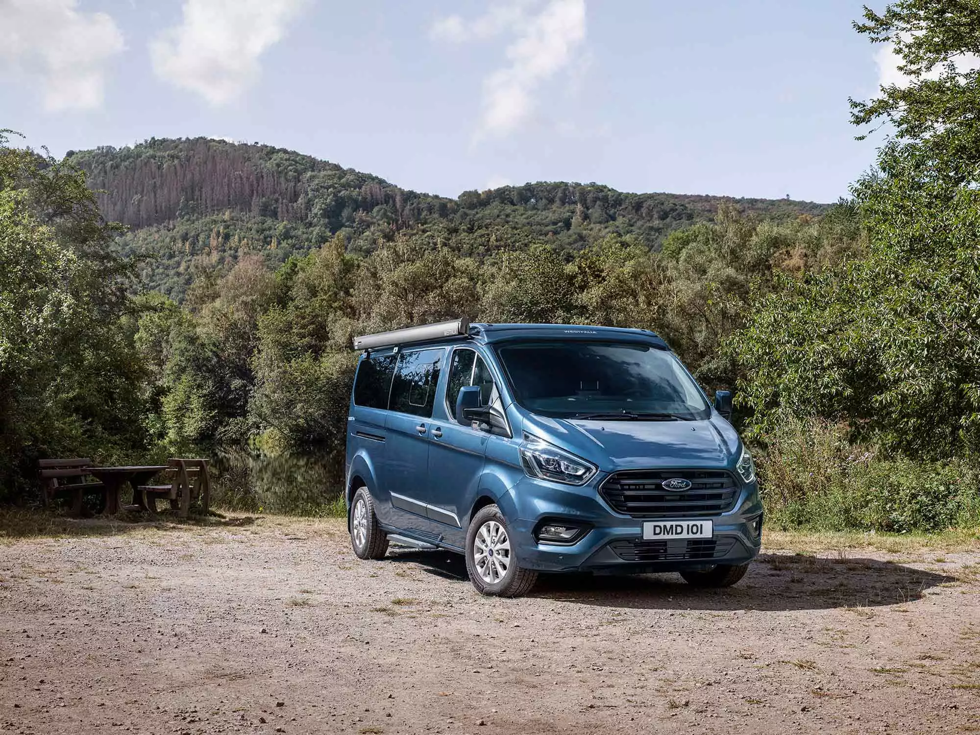 Unlike the high roof that comes along for travel, the pop-up roof dips low for easier maneuvering and parking