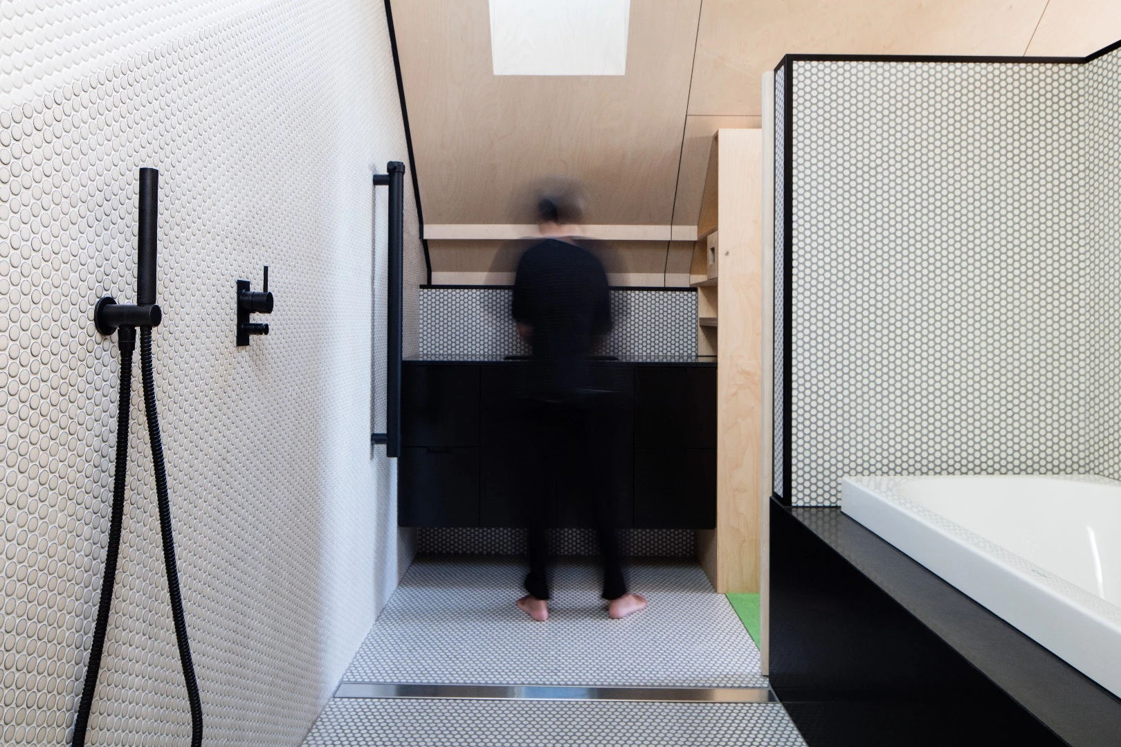 The Acute House contains two bathrooms: one in the basement and another ensuite for the master bedroom