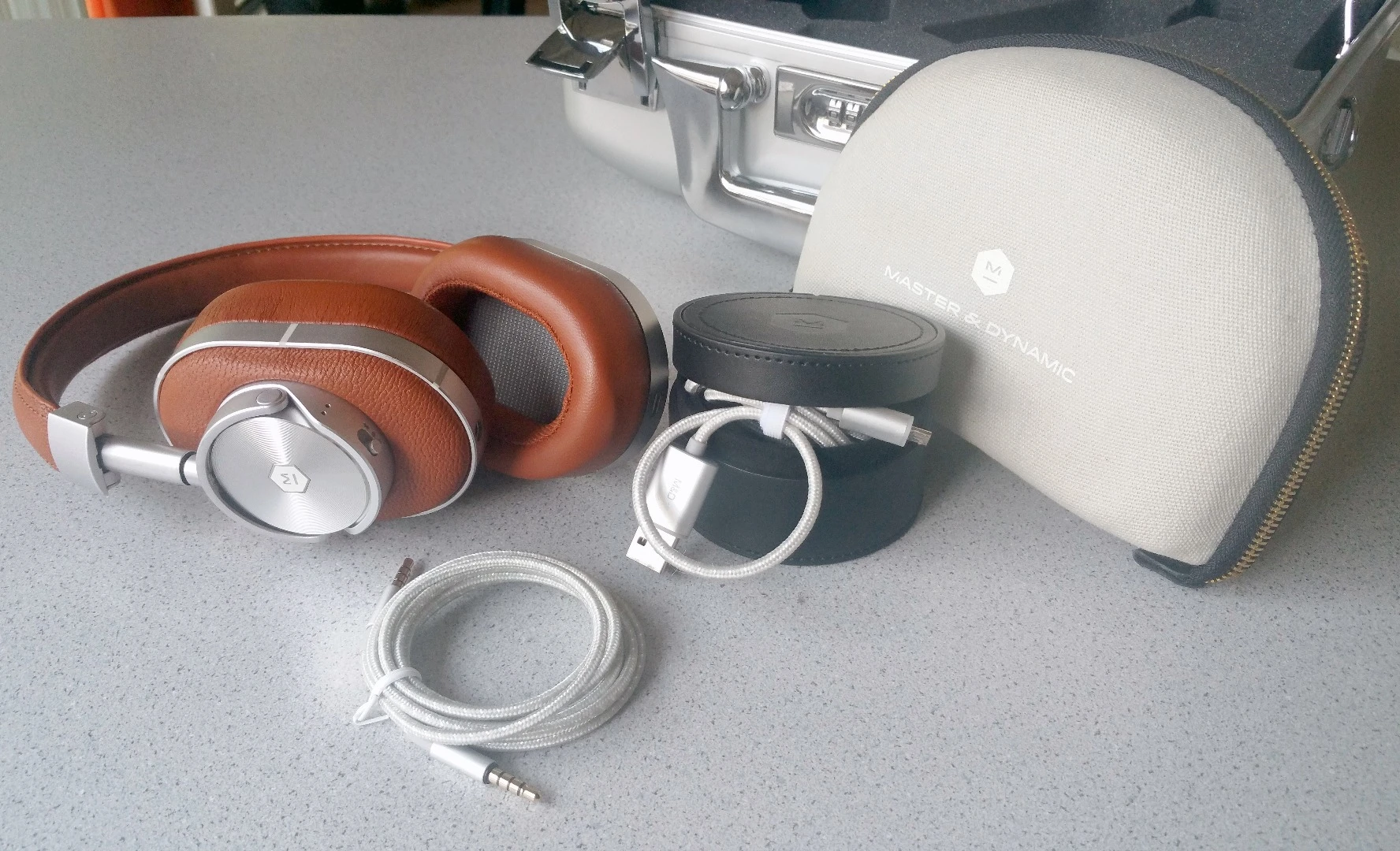 The whole kit and kaboodle comes with three cases, two cables, and one Master & Dynamic MW60 wireless over-ear headphones