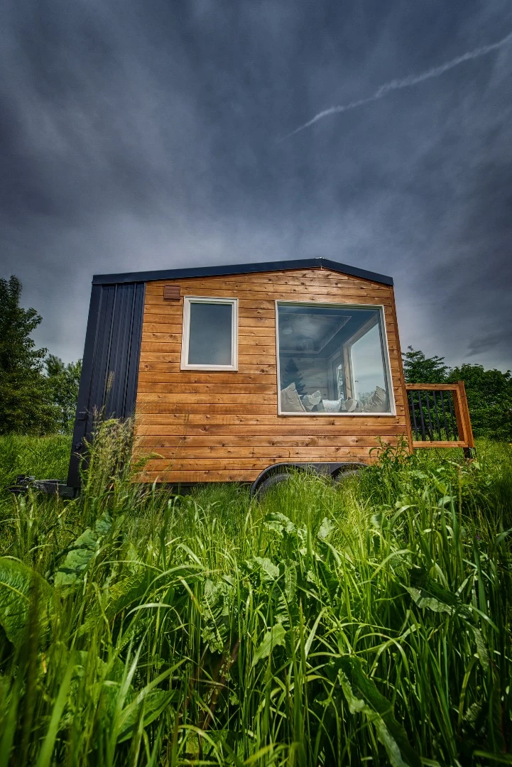 The Acorn is finished in tongue and groove and cedar, with corrugated metal accenting