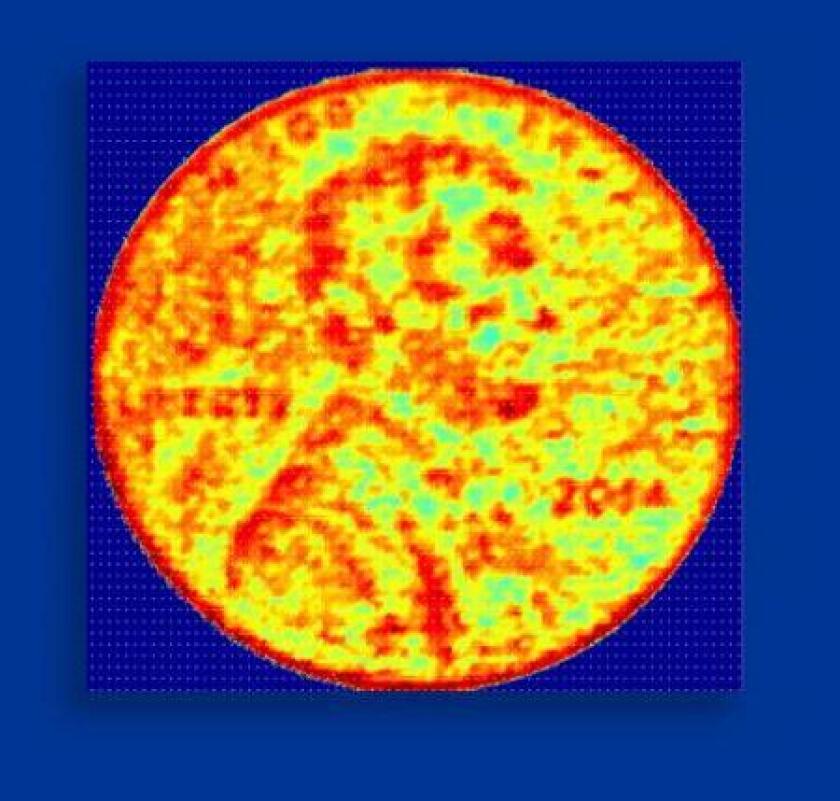A 3D image of an American penny produced by the NCI chip, with the colors corresponding to height at various points (Image: Ali Hajimiri/Caltech)