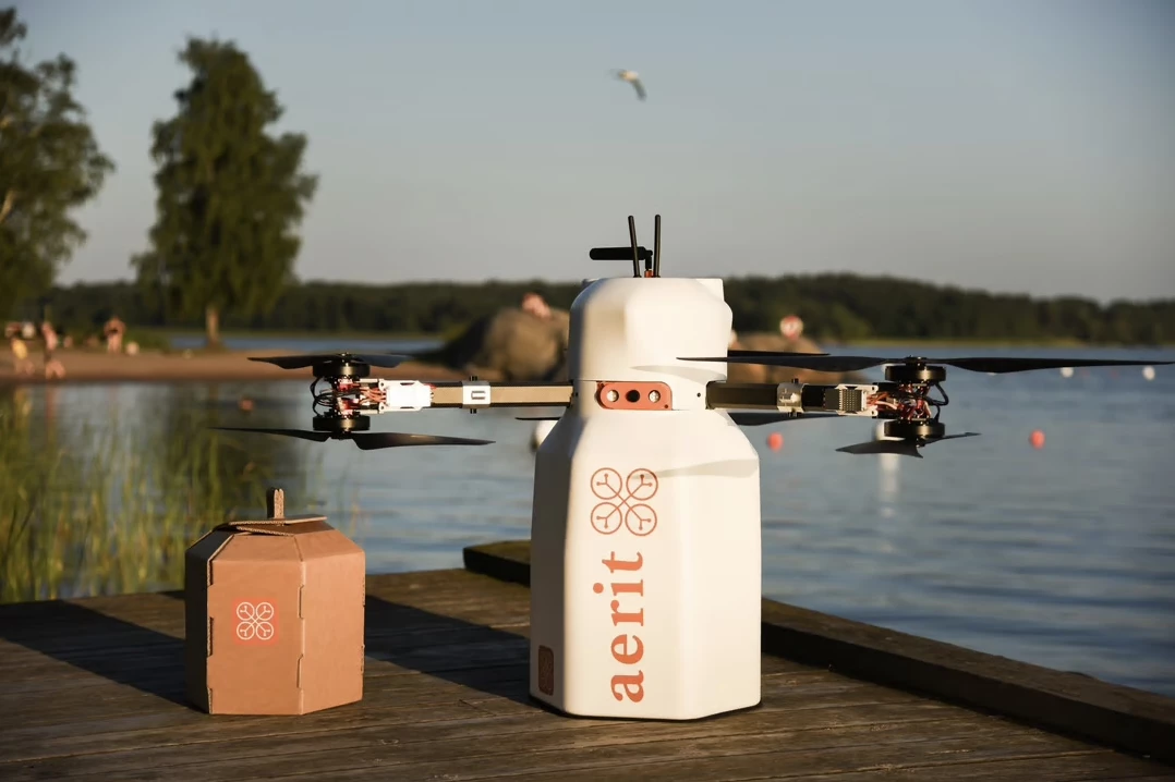 The Aerit Nimbi drone – which can deliver much more than just milk – along with one of its winch-lowered cartons