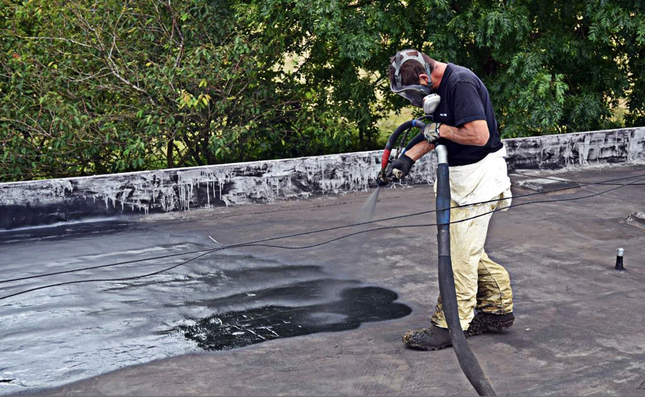 The coating is sprayed on an existing surface, then an aggregate material applied (Photo: Pro-Teq)