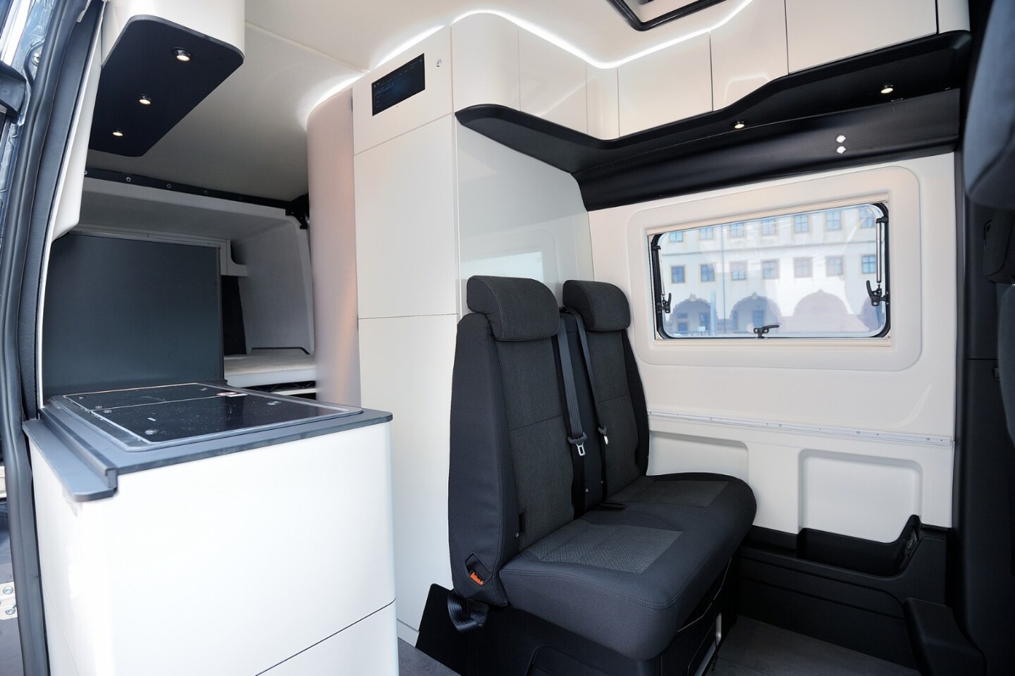 It's not entirely clear if that full-height unit behind the dining bench is a storage area and/or bathroom compartment, but it is clear that Westfalia has put a rather large control touchscreen up top