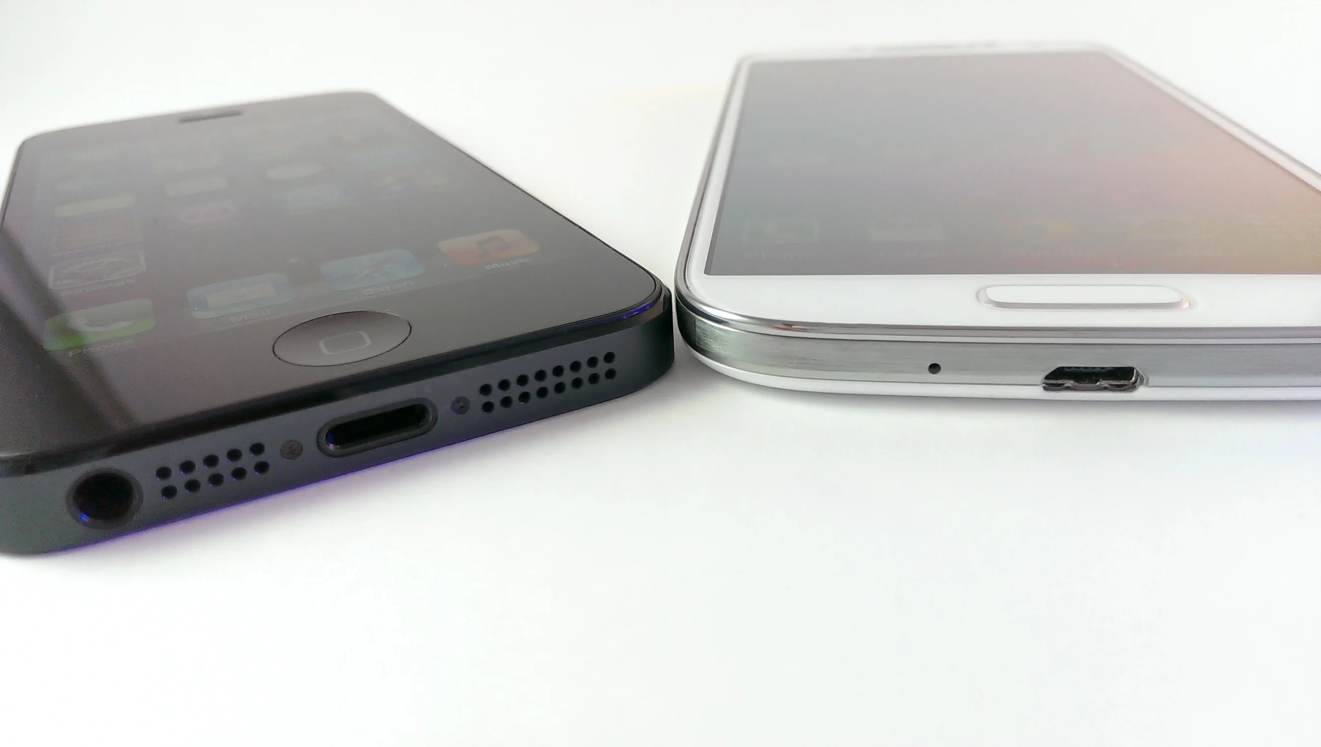 Each phone has a physical home button below the screen