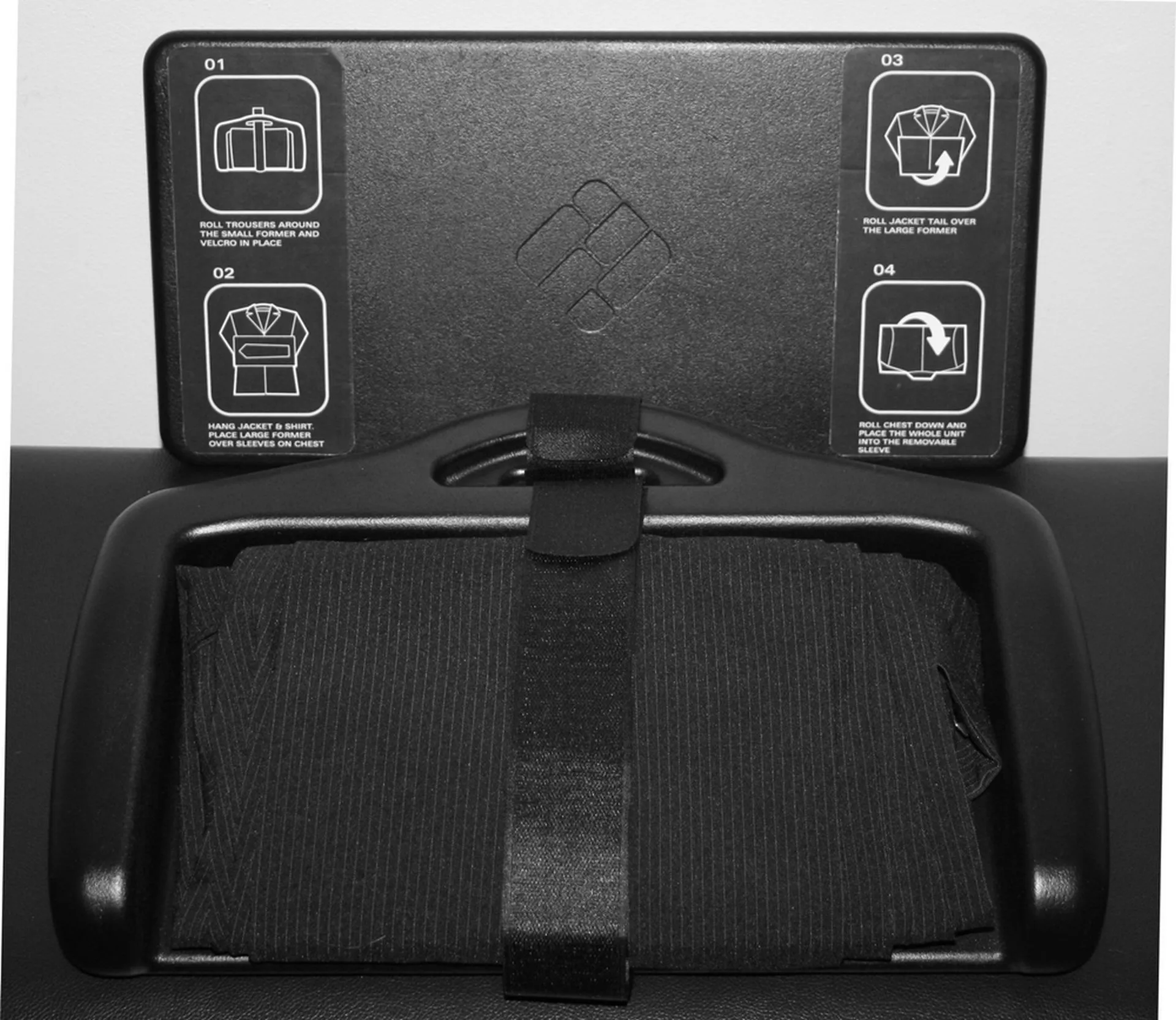 Trousers are secured in place using Velcro straps before the shirt and jacket are placed over the top of the main foam former
