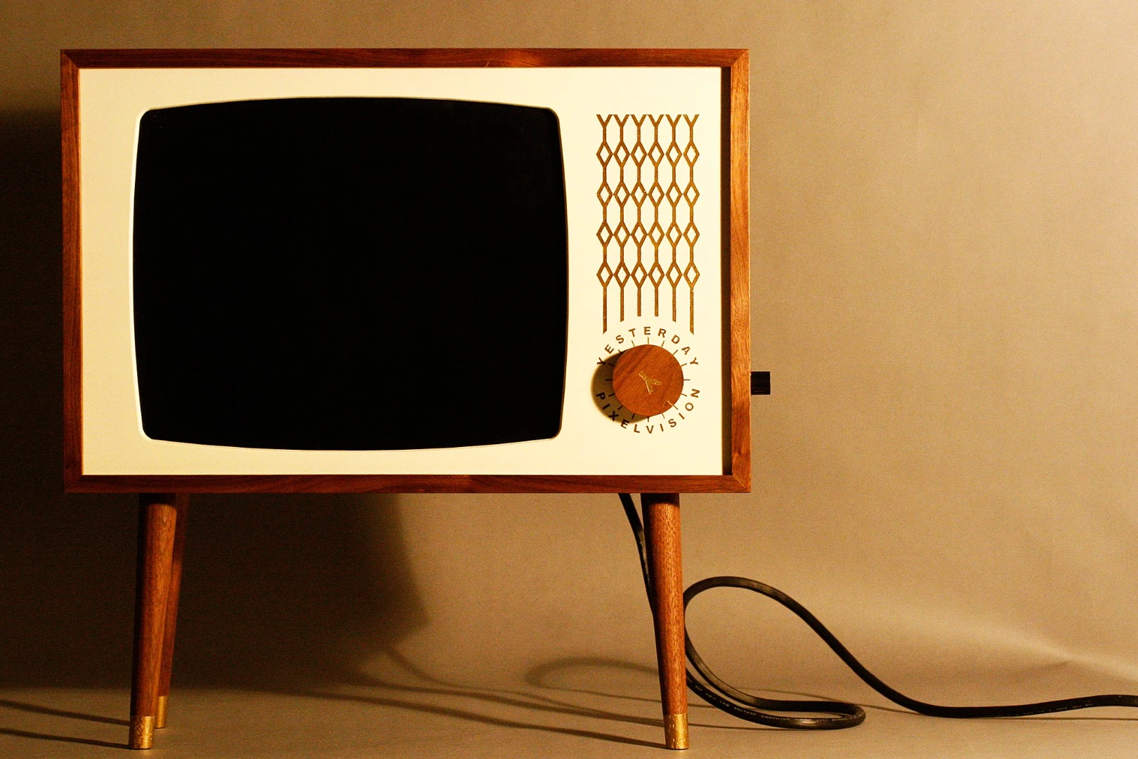 Yesterday Vision is a series of wooden enclosures for LCD televisions and monitors designed to replicate old TVs from the 1950s and 60s