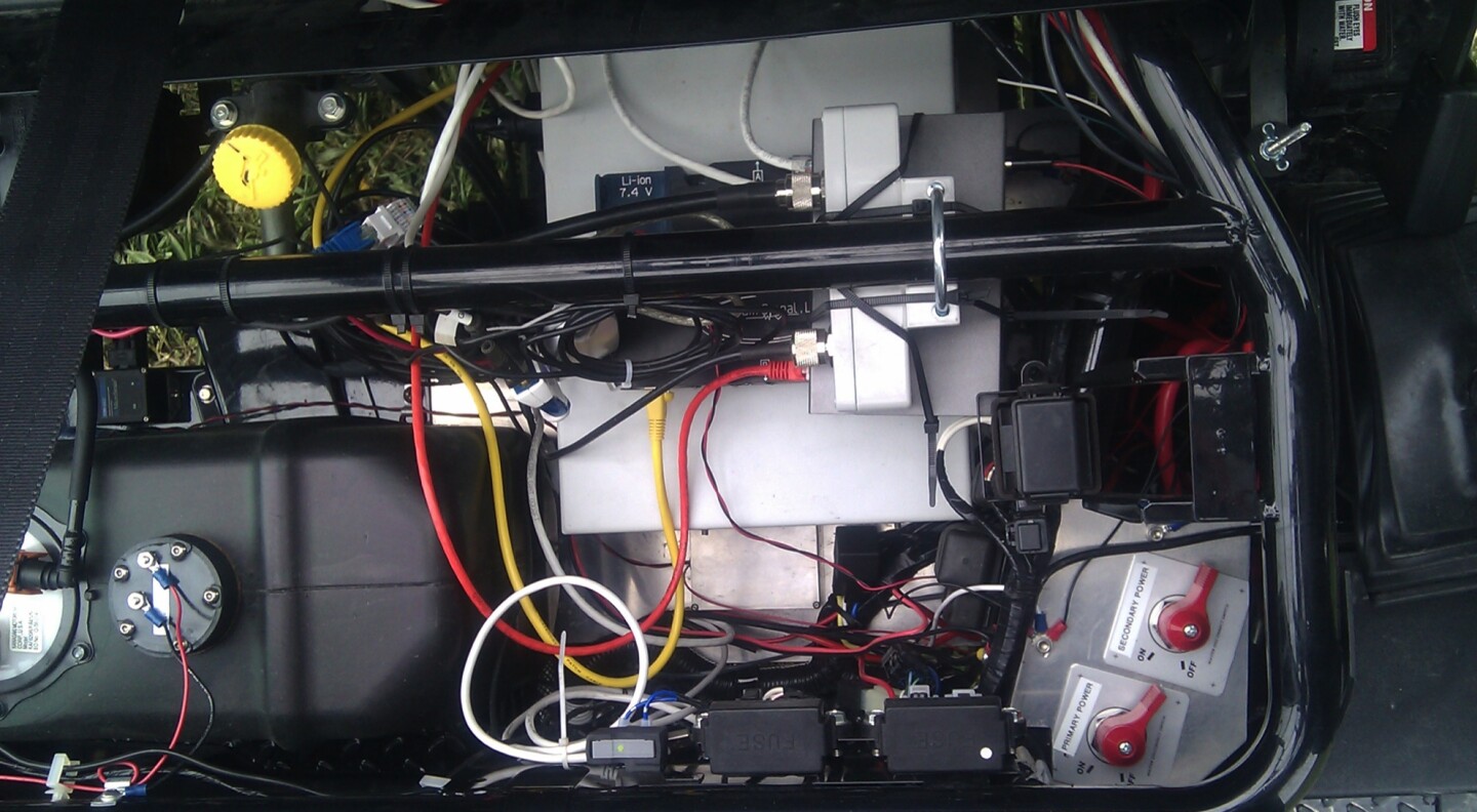 The utility vehicle is equipped with a Velodyne LIDAR, an inertial measurement unit, GPS, an onboard Linux PC for processing the sensor and positioning data and steering/accelerator/braking actuators (Photo courtesy of Sterling Anderson)