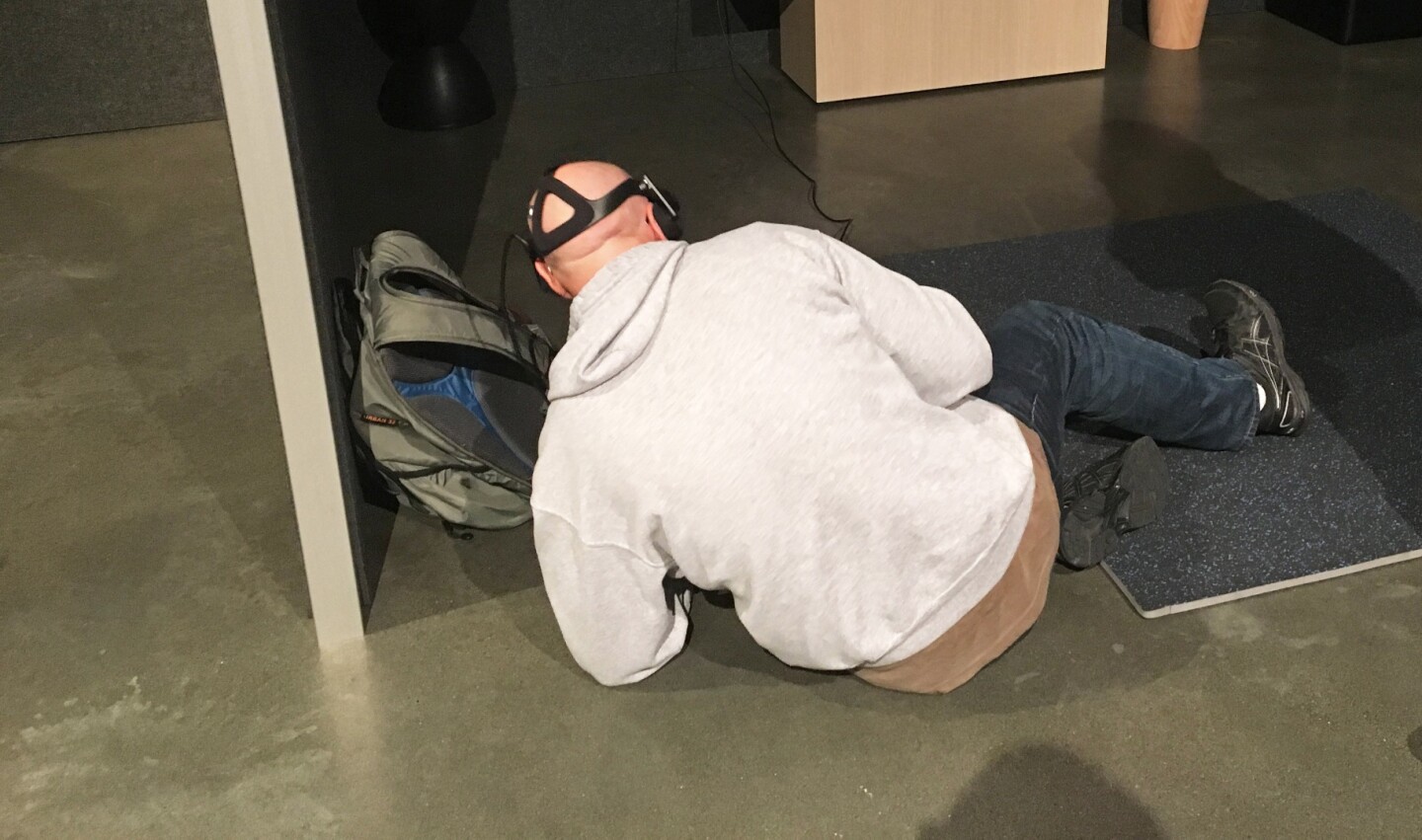 What's this fool doing? Why, he's taking cover in a wild west gunfight, of course