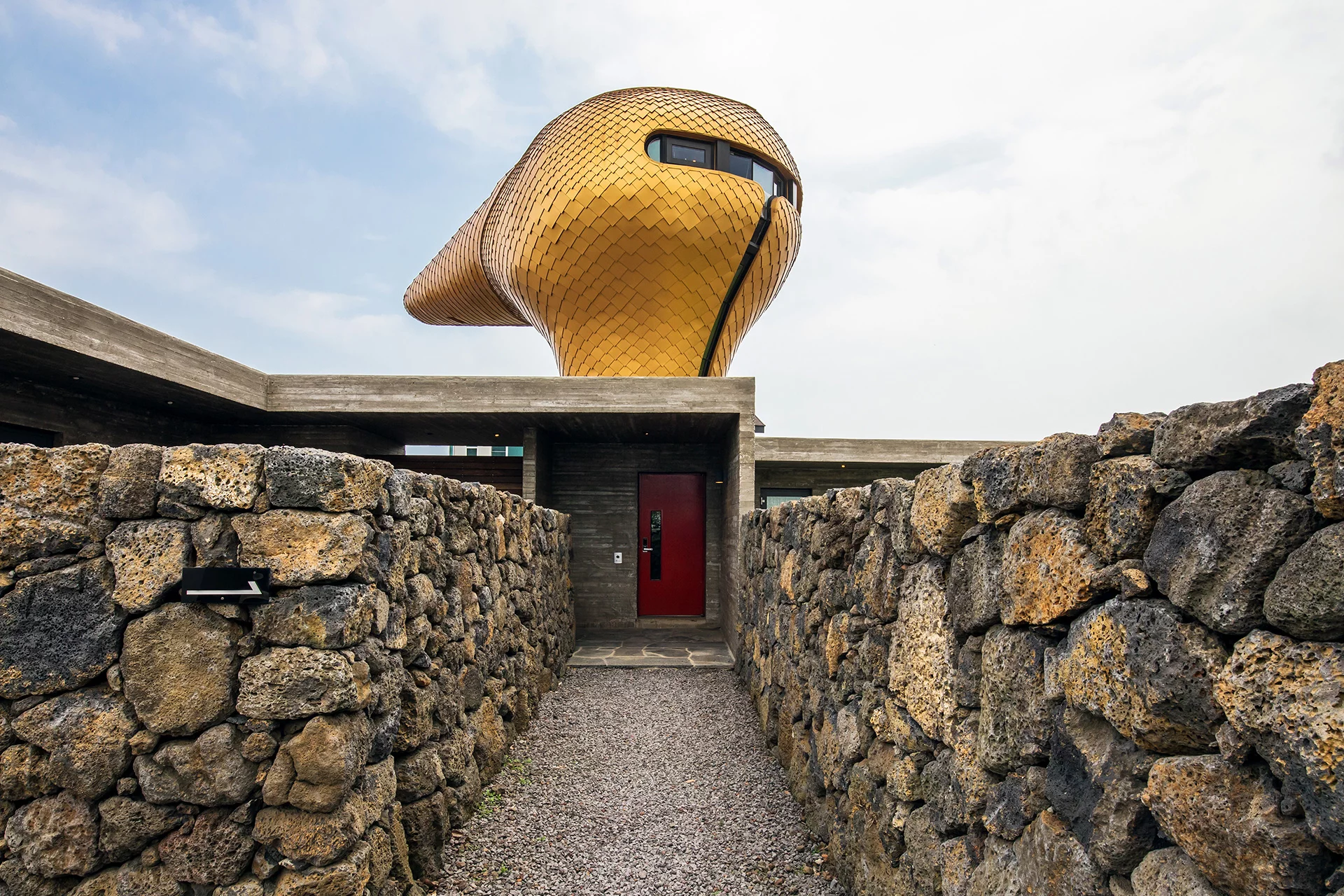 The Wind House, by Moon Hoon, is shaped like a duck's head and located atop a house in South Korea