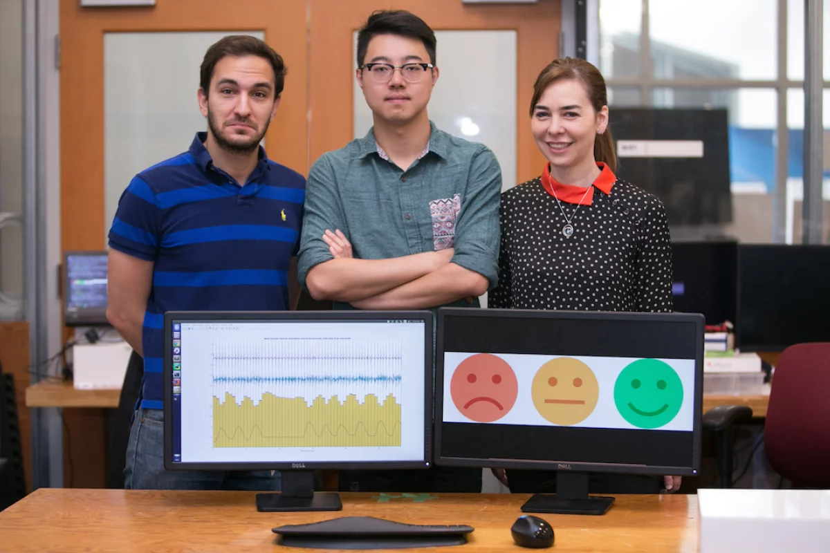 MIT CSAIL researchers Fadel Adib, Mingmin Zhao, and Dina Katabi have developed EQ-Radio, a device that uses RF signals to read a person's heartbeat and breathing, in order to infer their emotional state