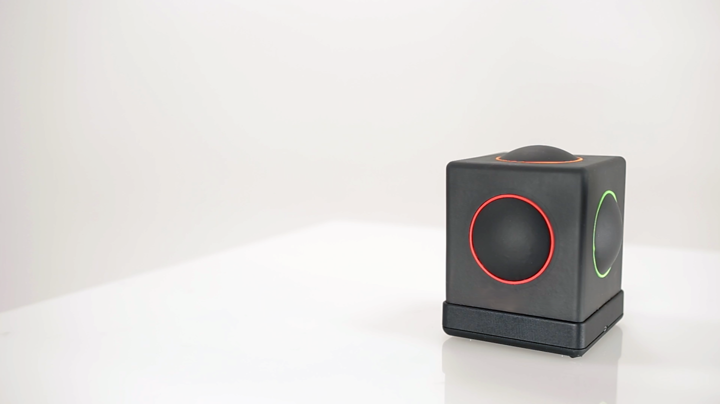 The Skoog 2.0 is a soft, squeezable, wipe-clean foam cube with spots on five of its faces