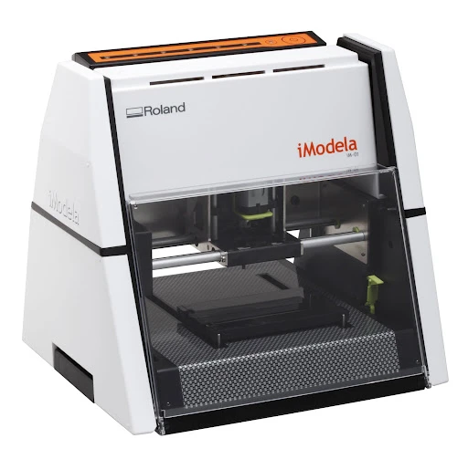 Rather than slowly building a model by layering the material, the iModela iM-01 3D Modeling Machine carves its creations down from a larger block of material