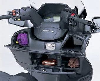 The Burgman also has the feel of a luxury car in that it is extremely well appointed there's a light in the storage compartment which switches on automatically when you lift the seat, illuminating the entire area, reminiscent of BMW-style thoroughness. The front fairing contains three compartments which became incredibly useful having a glove box on a motorcycle is far more useful than in a car!