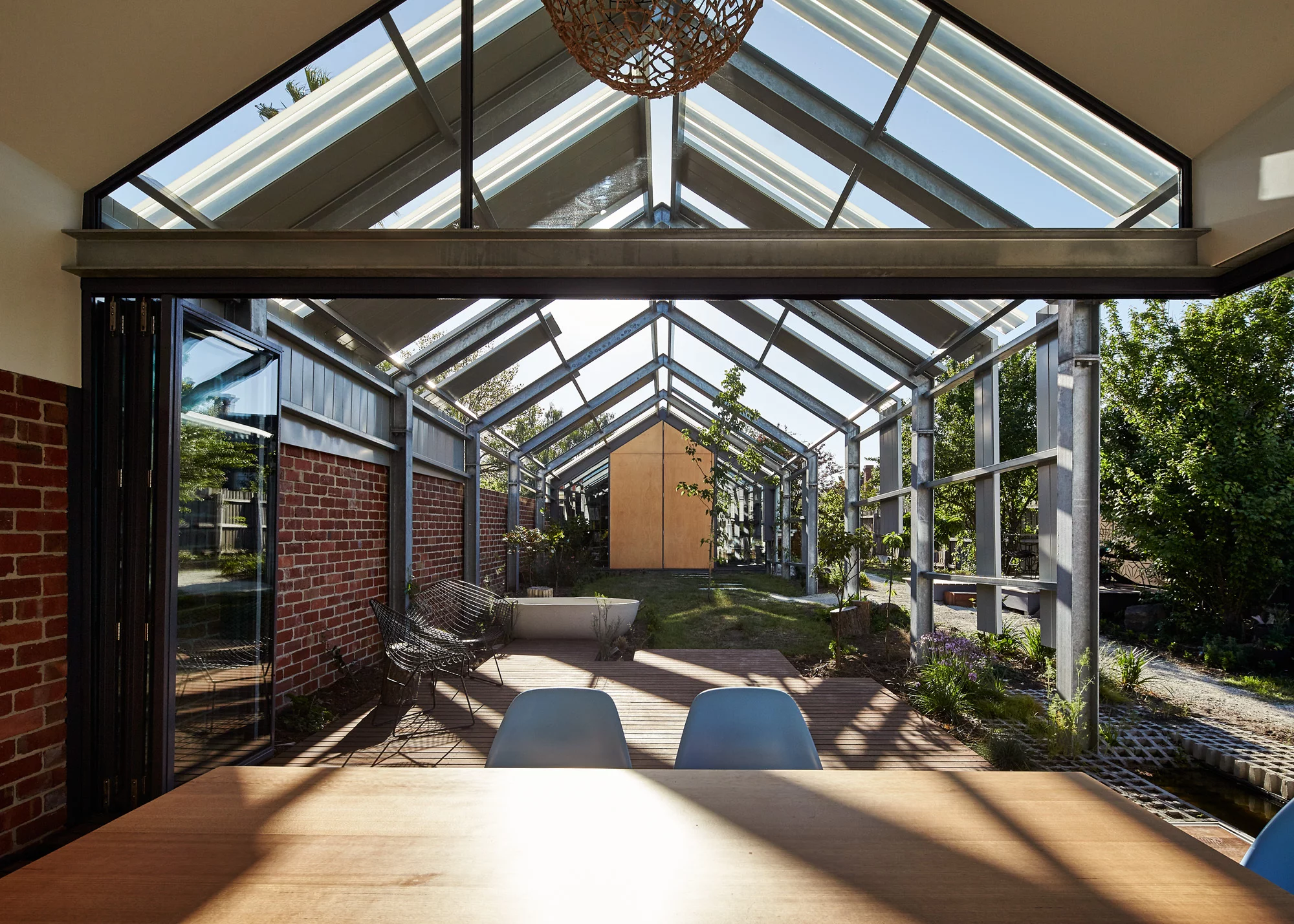 Rainwater is directed from the roof to water tanks which provide water for toilet-flushing, the washing machine and garden irrigation (Photo: Peter Bennetts)