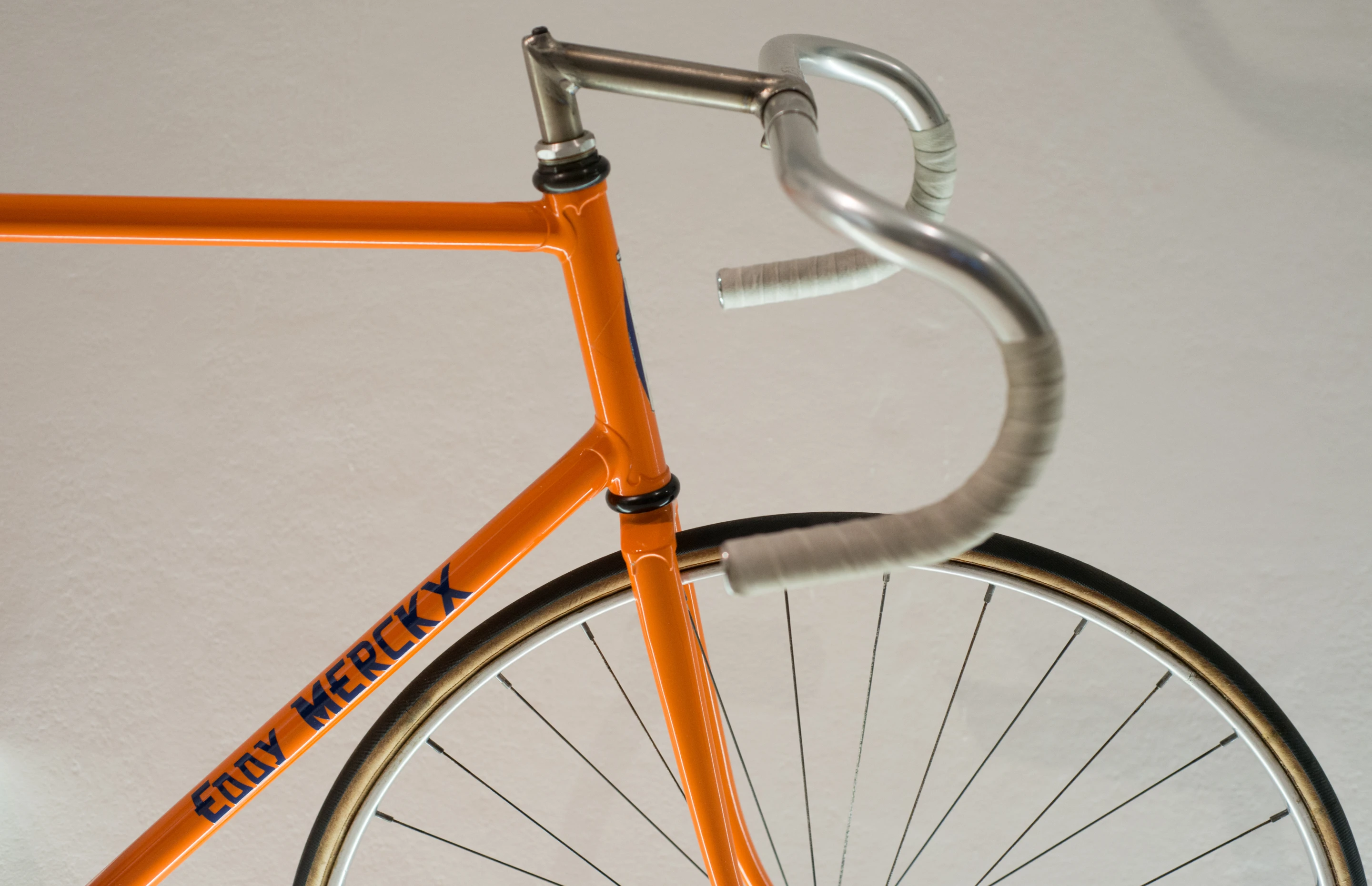 Eddy Merckx's tubular steel frame bike with drop handlebars and wire spoke wheels was designed and built by Colnago
