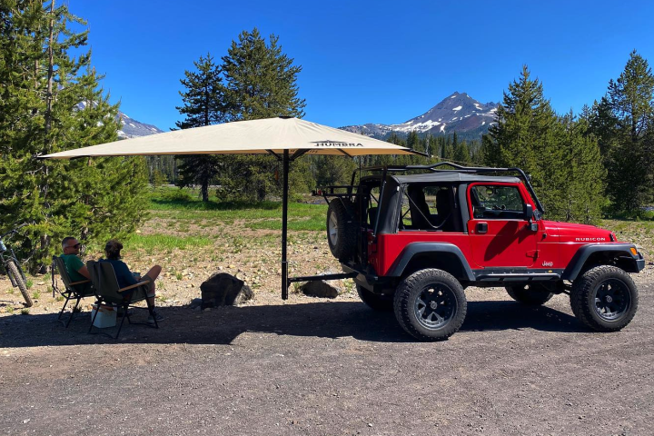 Enjoying some fast-pitching shade courtesy of the Humbra Firefly hitch-mounted awning