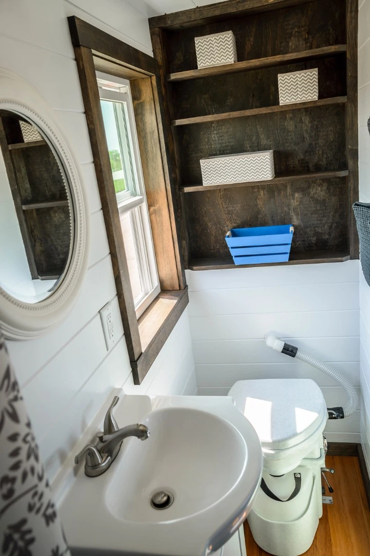 The bathroom includes a toilet, shower, and sink