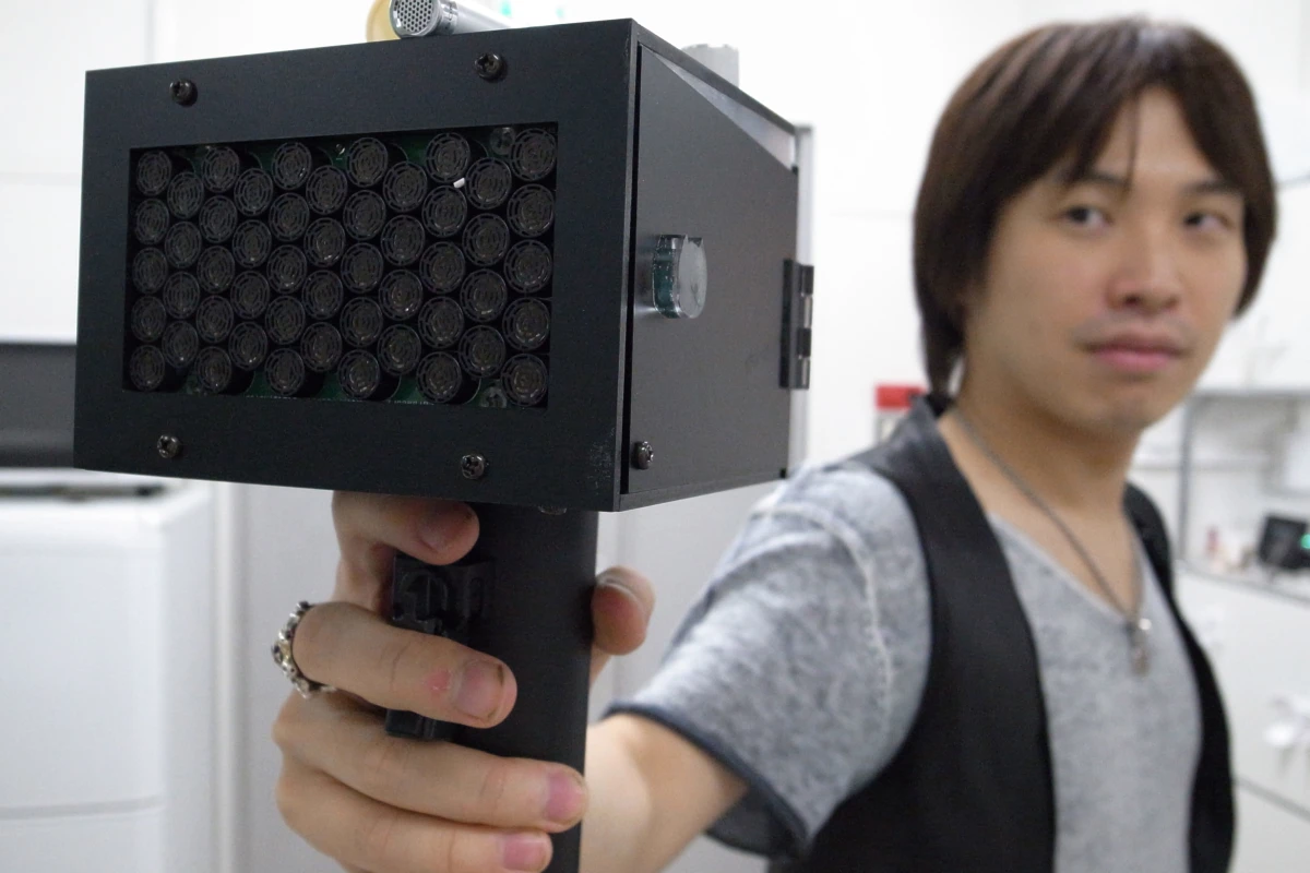 A Japanese team has invented a portable device that painlessly causes people to stop talking