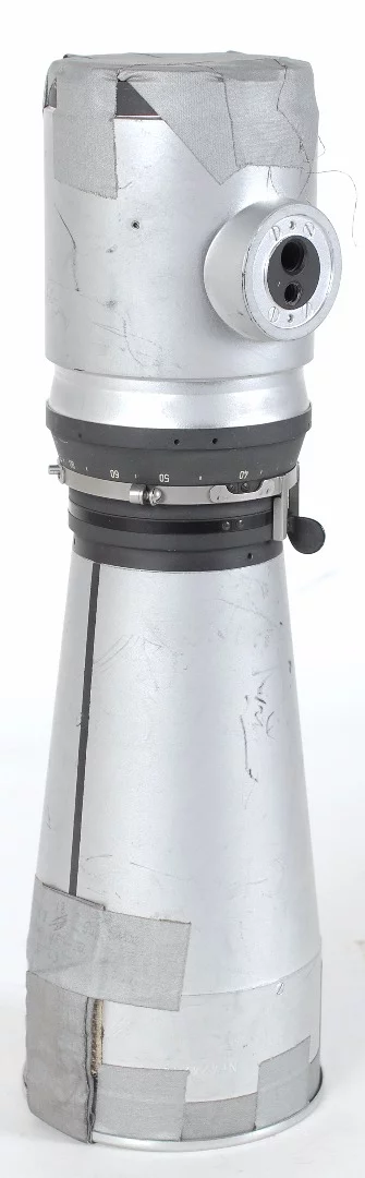 The tape on the lens retains particles of lunar dust