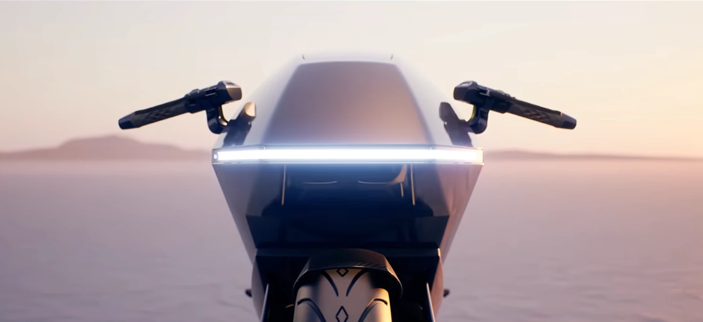 The bike features a diamond-shaped front end with a sleek horizontal LED light strip, an inventive headlight, and an equally sharp rear