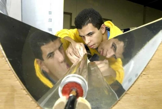 Denilson Luz Freitas, 18, from Bahia, Brazil, with his project, an environmentally-friendly device that converts solar energy into thermal energy
