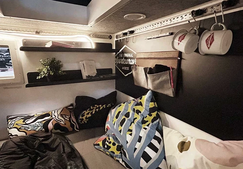 Sportcaravan makes its Cube a home with plenty of shelves, tie-down track and storage organizers