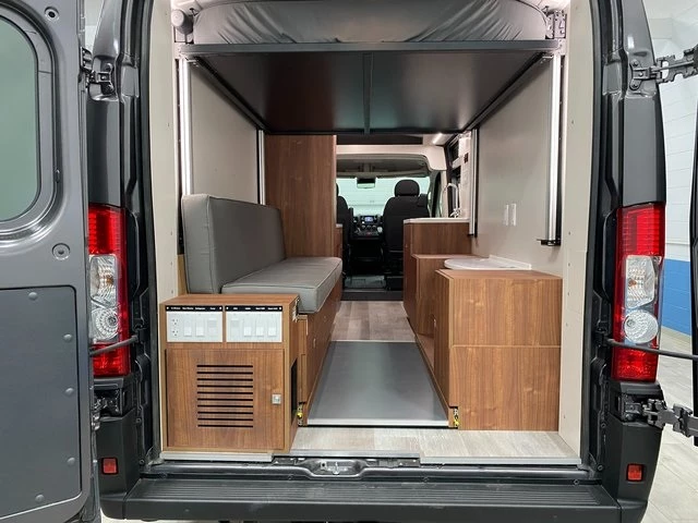 Van Horn's most expensive ProCamp van, the Destiny, trades out the rear passenger-side seats for cabinets and a portable toilet