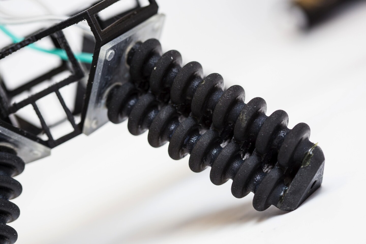 A close-up of the robot's soft pneumatic legs