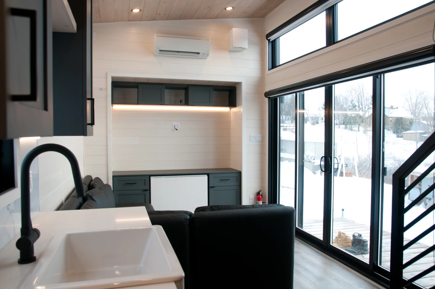 Visitors enter the Magnolia V7 through a large glass sliding door