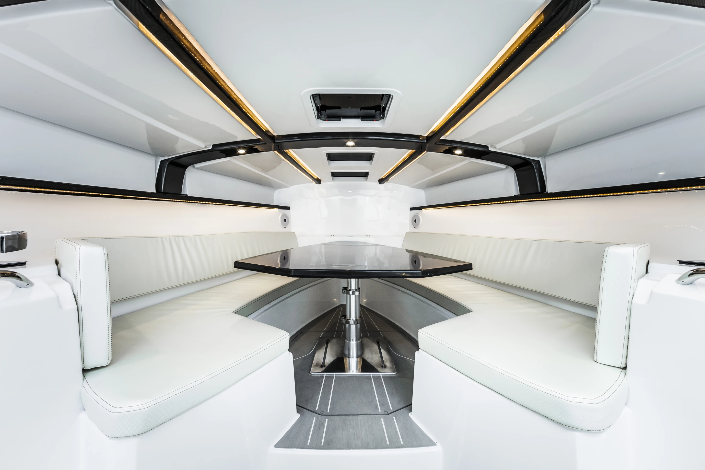 A couch and table in the 44GT's cabin