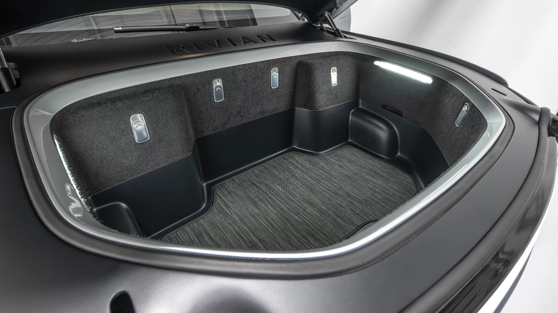 With no engine up front, the R1T has a 330-L front storage trunk