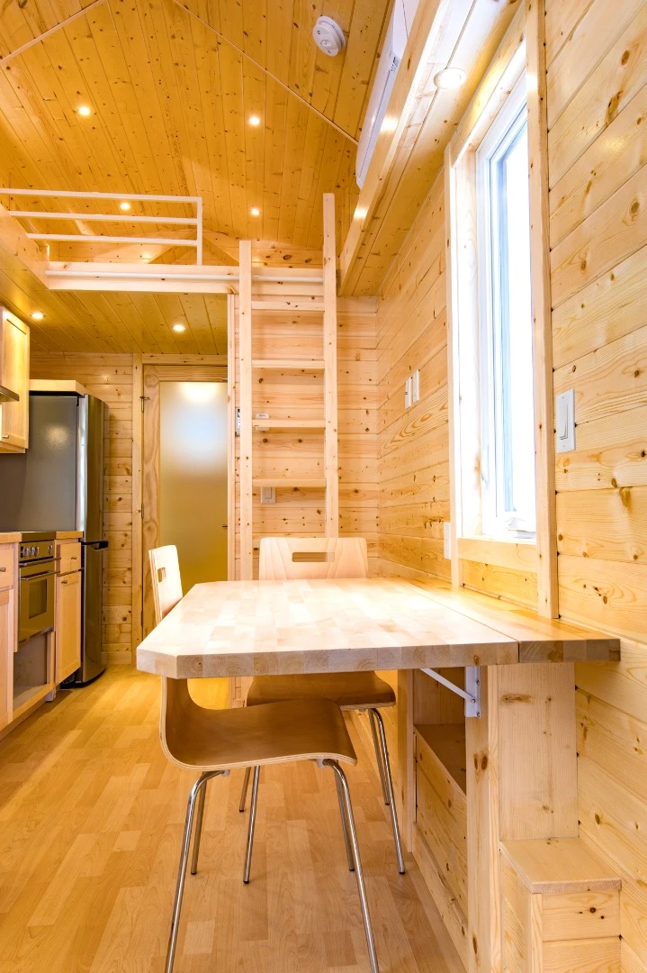 The Tradition's main living area includes a drop-down table that can also serve as a desk
