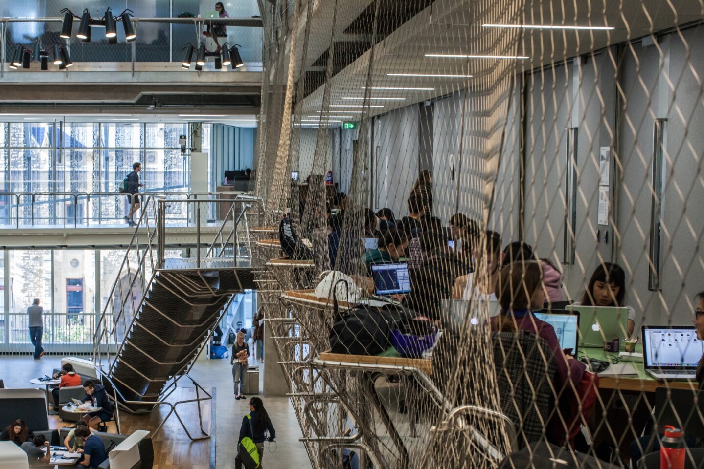 Up one level is where the studios and teaching spaces begin, but rather than lonely corridors and closed stairwells, the floor opens up to a mammoth four-story atrium bathed in natural light