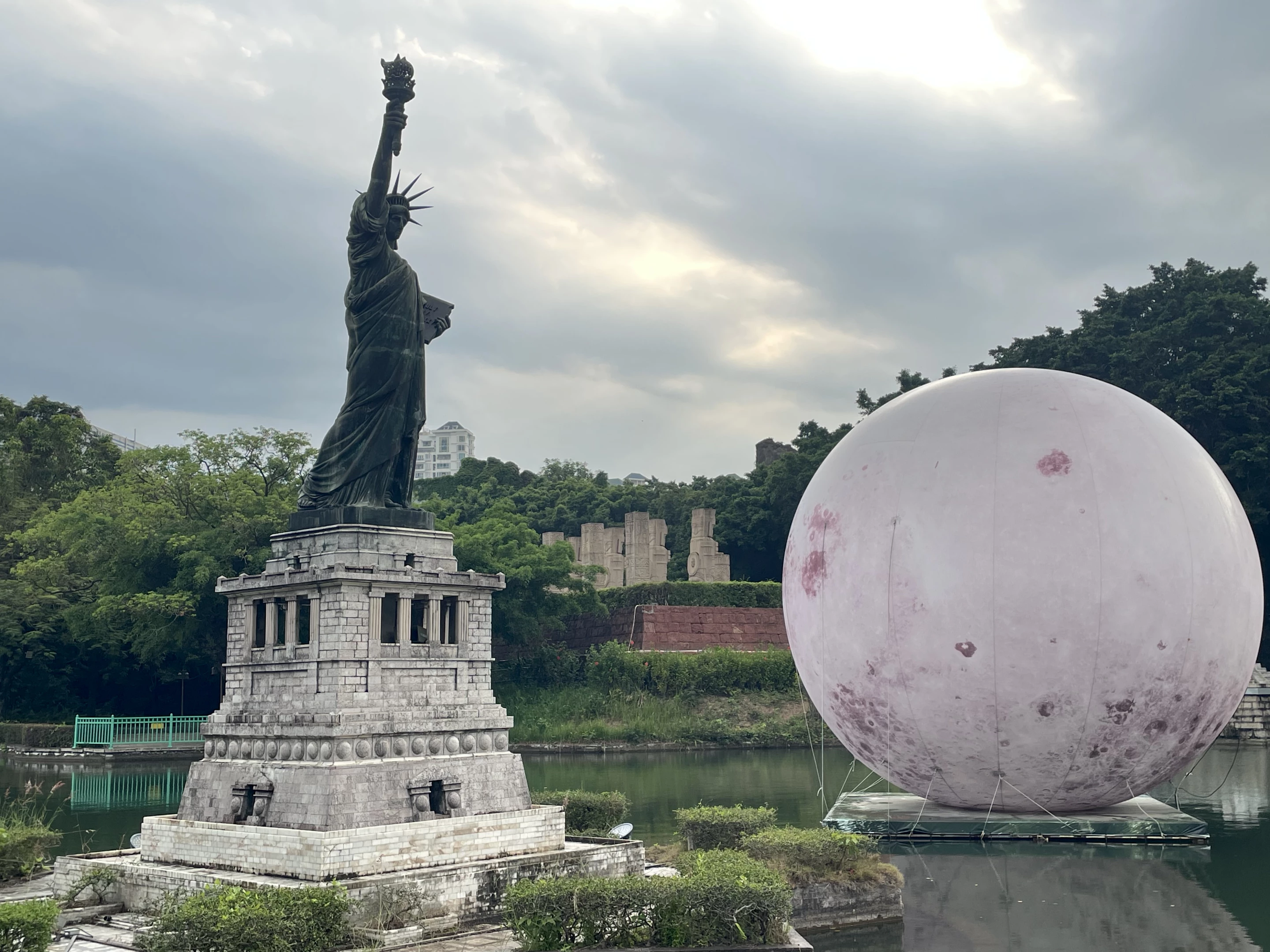 The Statue of Liberty and one of the many installations that make more sense when viewed after the sun goes down
