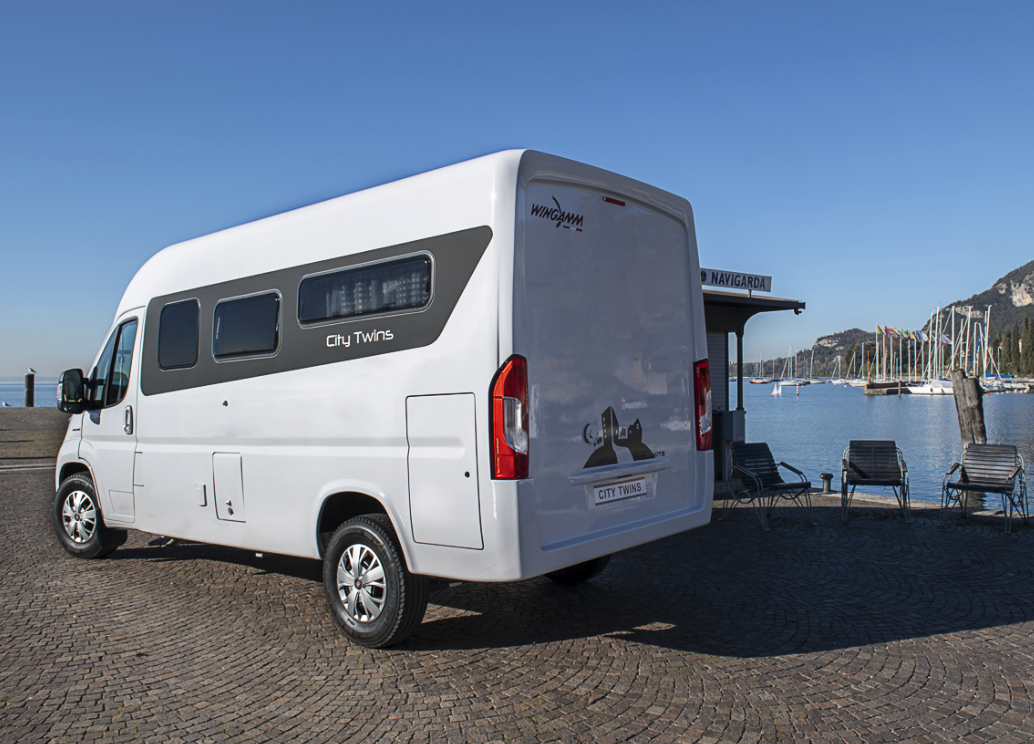 No rear load doors on this Ducato camper; the solid rear wall creates a cozier, more closed-off interior space