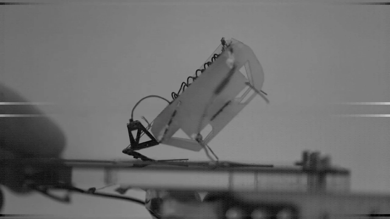 A frame from an ultra-slow-motion video, showing how the robot's furcula strikes the ground at the start of a jump