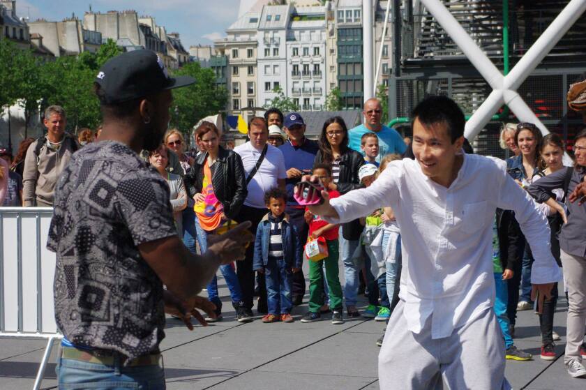 Paris crowds gather for a public demonstration of the Interaction Music Battke
