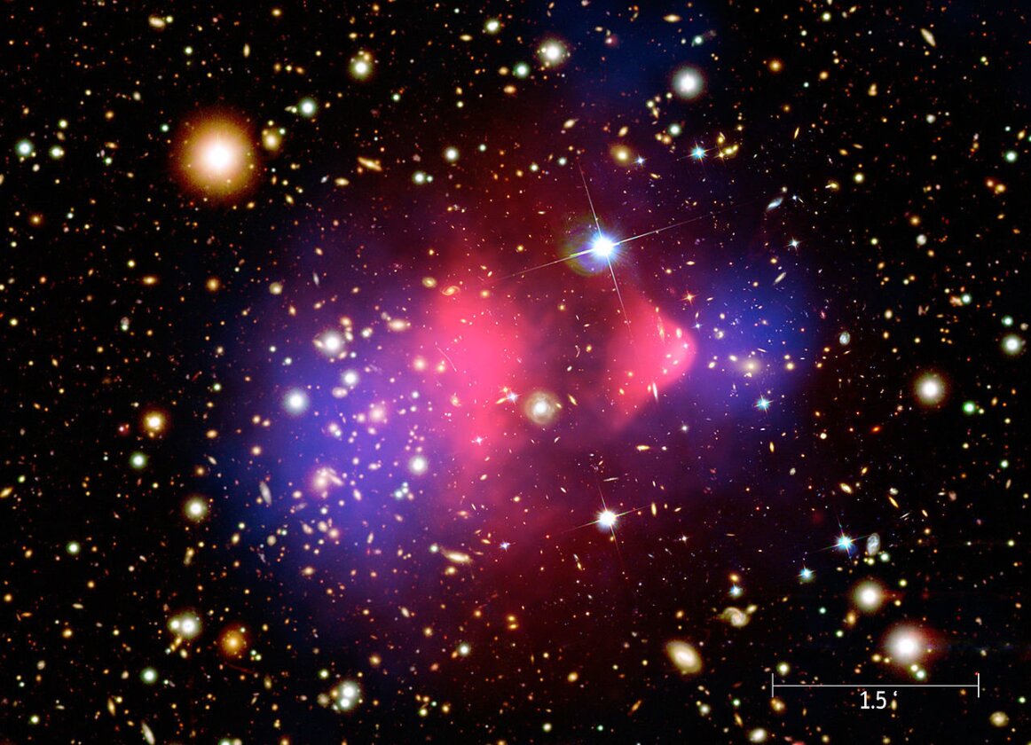 A composite image showing galaxies in optical light, x-ray emissions in pink and invisible mass – or dark matter – in blue.