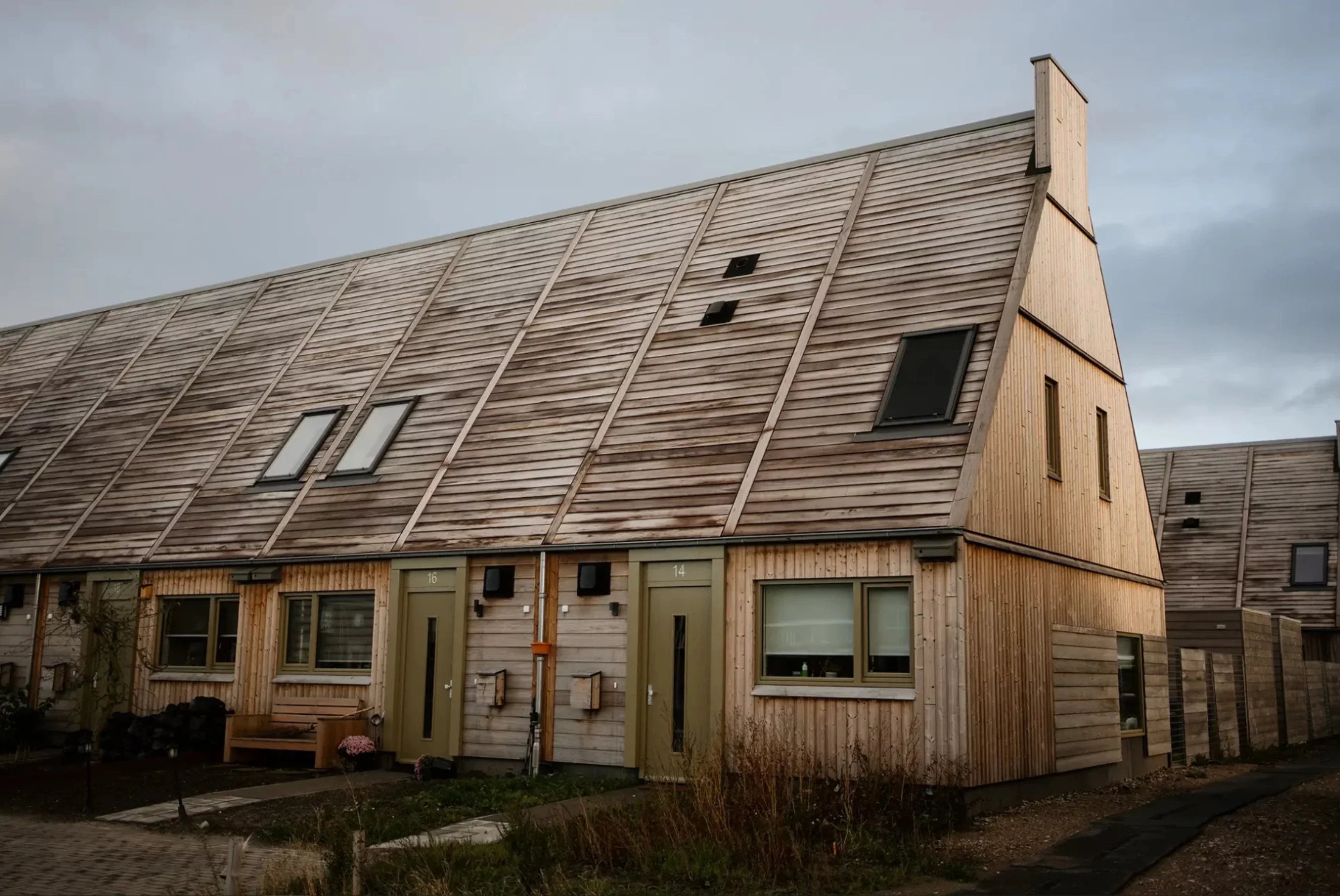 The homes use prefabricated timber manufactured off-site and assembled on-site to reduce construction time and local environmental impact