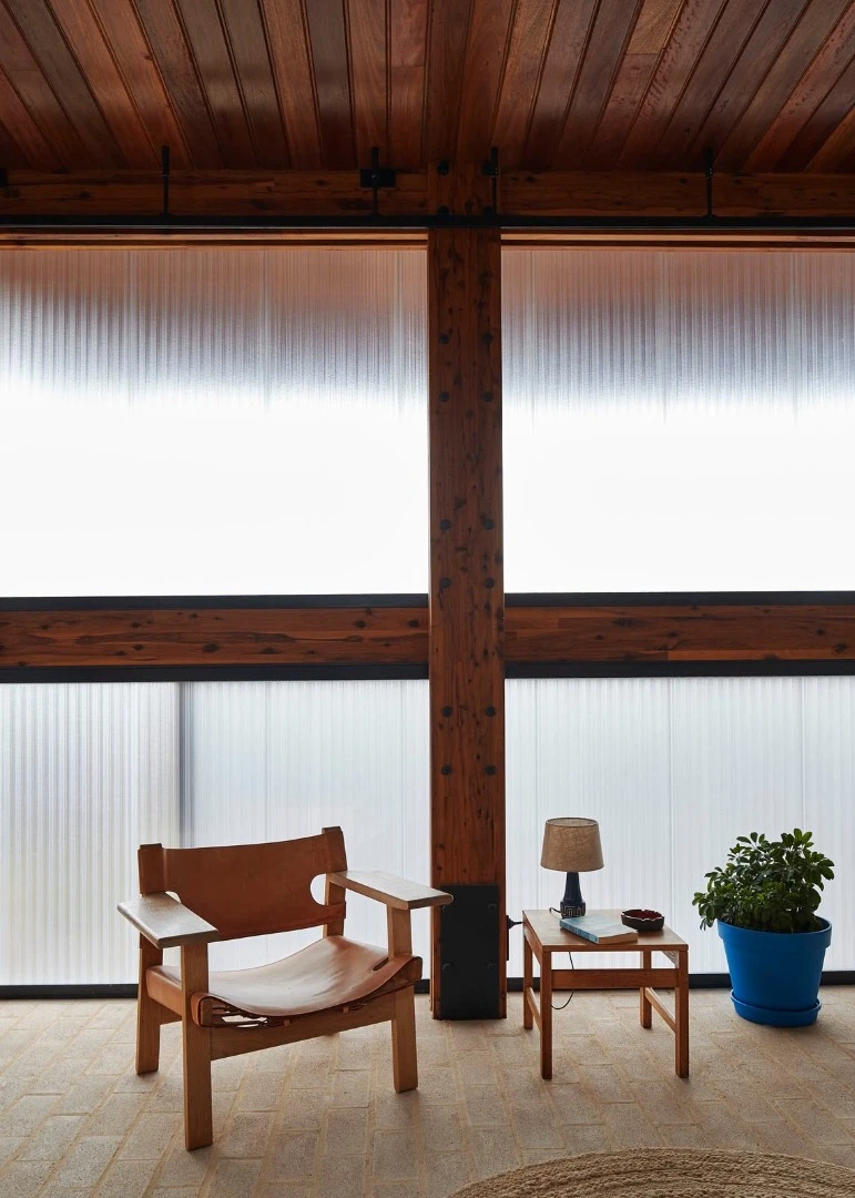 Dorman House's ground floor polycarbonate-clad bedroom is a utilitarian space originally intended as a kid's playroom but the owners loved it and decided it could serve as their bedroom