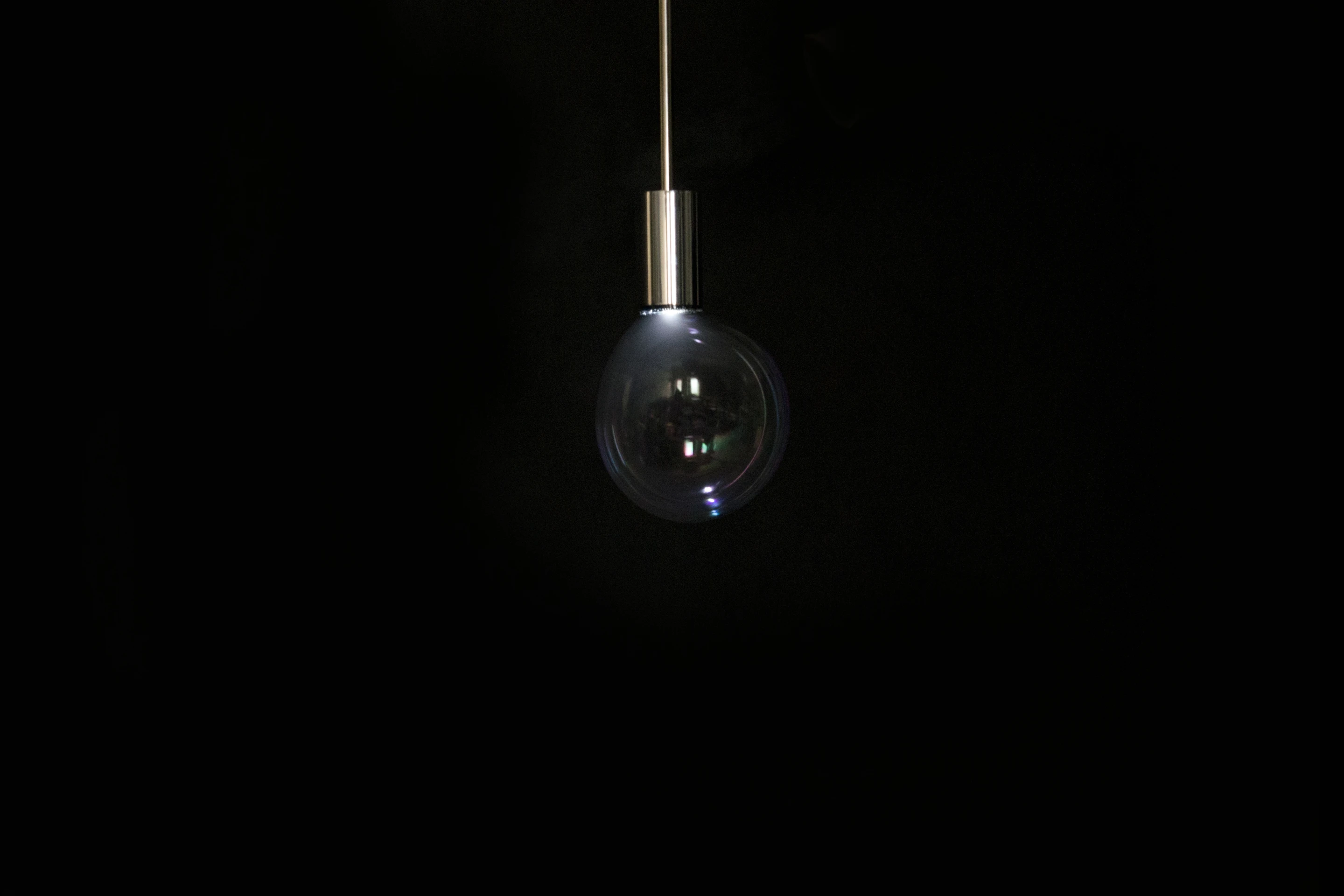 Instead of a lampshade, the Surface Tension Lamp continuously blows bubbles