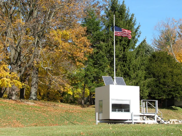 The micro home has the optional of being installed with roof photovoltaic solar panels that are combined with a small diameter vertical axis wind generator