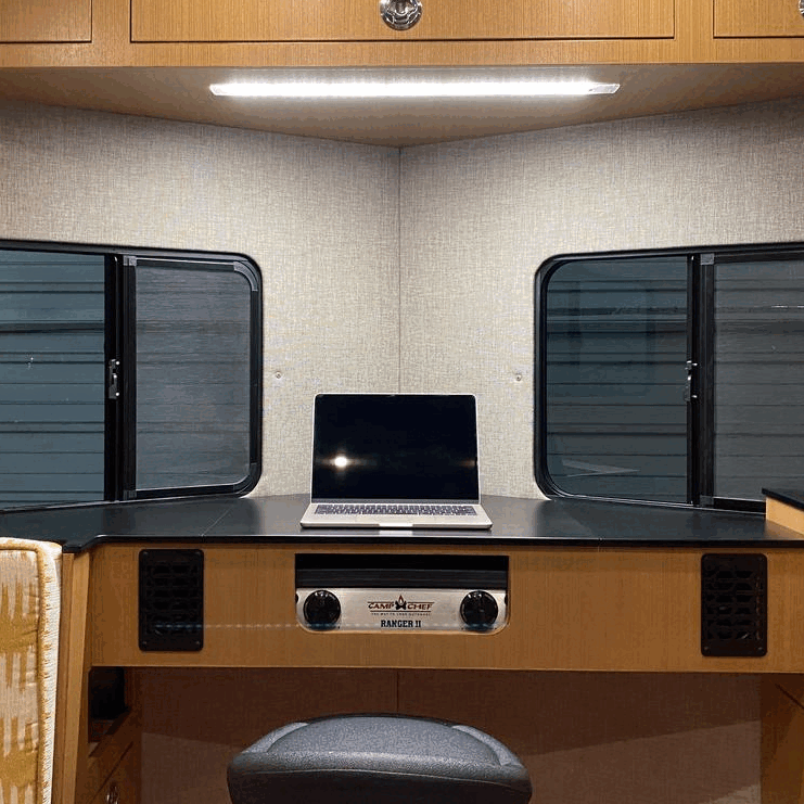 Tetravan's dual-purpose cook/workstation makes use of what might otherwise be an inefficient, space-wasting part of the trailer