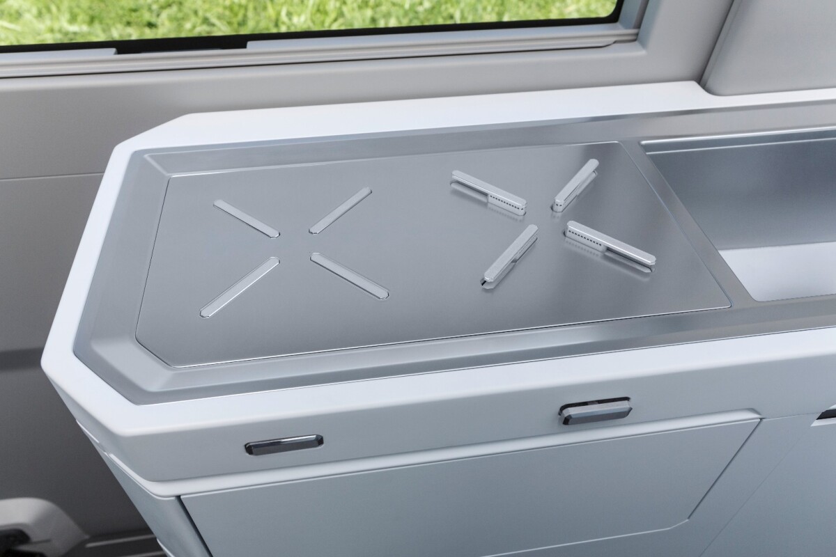 The electrically retractable burners allow the stovetop to double as a worktop