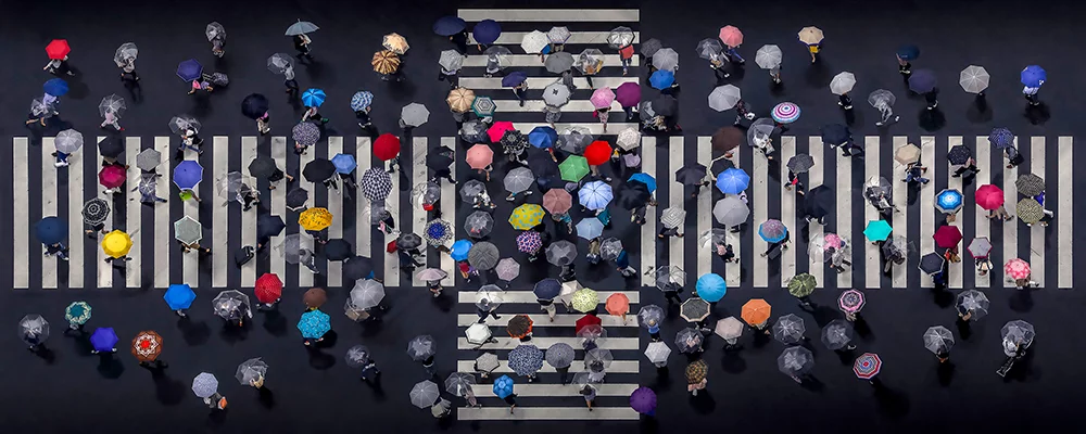 1st Place, Professional, Panoramic. Umbrellas crossing a street in Japan in 2018